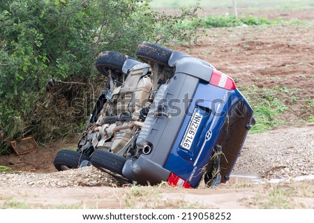 THESSALONIKI, GREECE- SEPTEMBER 15, 2014: Car overturned with one dead from the flood in Liti near Thessaloniki, Greece. Several main roads in Greece became flooded due to strong downpour.