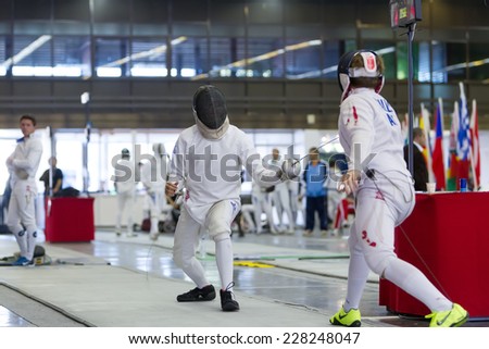 THESSALONIKI, GREECE - OCT 19, 2014 : Young athletes competing during the World Youth Fencing Championships 2014. Over 150 fencers from 25 countries took part at the championships.