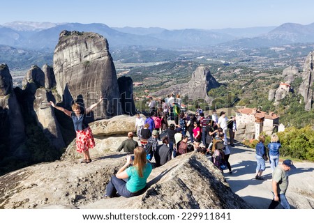 METEORA, GREECE - OCTOBER 12, 2014: Tourists taking pictures during their tour at Meteora, Greece.