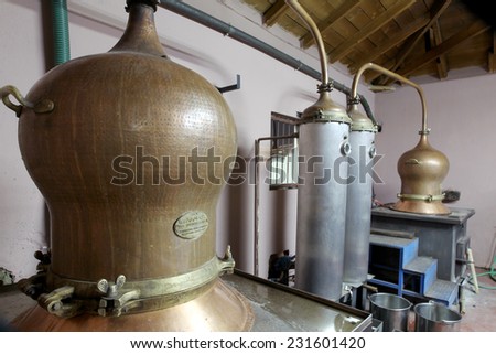 DRAMA, GREECE - NOVEMBER 15,2014: During traditional distillation of alcohol and production of homemade tsipouro/raki