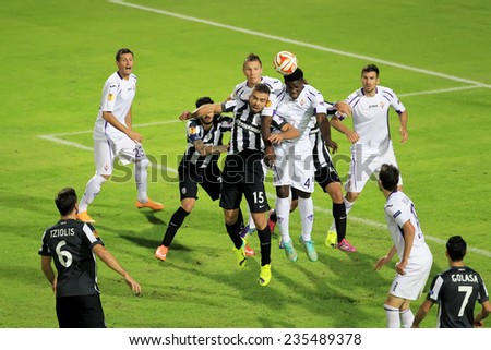 THESSALONIKI, GREECE - NOV 12, 2014 : Vitor (L) of Paok in action with Richards (R) of Fiorentina during the UEFA Europa League match Paok vs Fiorentina.
