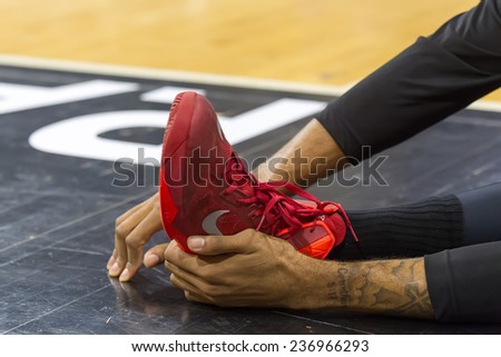 THESSALONIKI, GREECE - NOV 12, 2014: Undefined hands doing foot exercises prior to Eurocup game Paok vs Budocnost