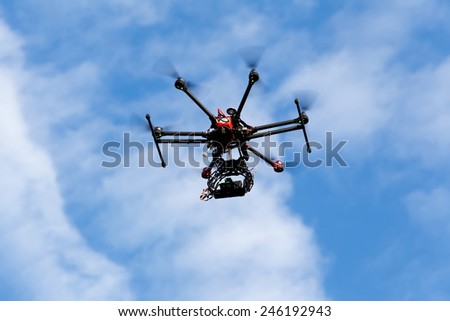 ATHENS, GREECE- DECEMBER 20, 2014: DJI S900 drone in flight with a mounted sony A7  Edition digital camera in Athens, Greece. DJI Industries produces unmanned aircraft for surveillance
