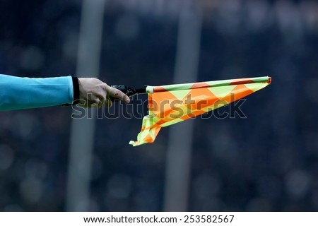THESSALONIKI, GREECE FEBRUARY 8, 2015 : Referee shows the flag during the Greek Superleague match PAOK vs Olympiacos
