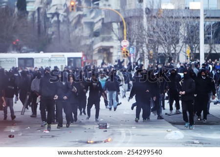 THESSALONIKI, GREECE FEBRUARY 8, 2015 : Police is fighting with the protester fans prior to the Greek Superleague match PAOK vs Olympiacos