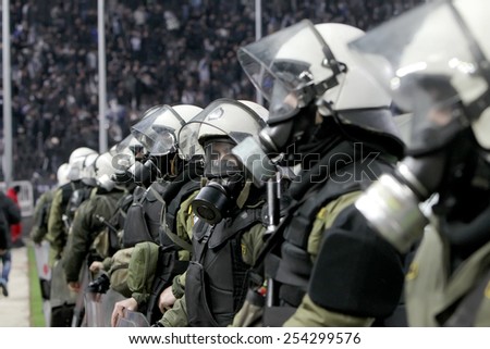 THESSALONIKI, GREECE FEBRUARY 8, 2015 : Police with gas masks in the stadium during the Greek Superleague match PAOK vs Olympiacos