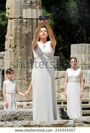 OLYMPIA , GREECE, MAY 9, 2012: High Priestess, the Olympic flame during the Torch lighting ceremony of the Olympic Games in London in 2012 at ancient Olympia