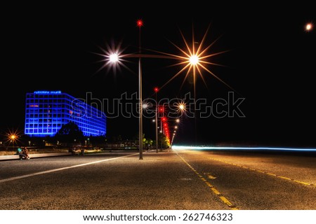 THESSALONIKI, GREECE- JULY 7, 2014: Makedonia Palace at night in Thessaloniki, Greece. Makedonia Palace is located on Thermaikos Gulf, while the White Tower is