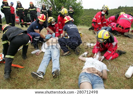 ILIA,GREECE,MAY 21,2015:Pan-European exercise of the Fire Brigade with evacuation and village houses complex, stalking and arson suspects arrested them, rescuing injured firefighters and citizen