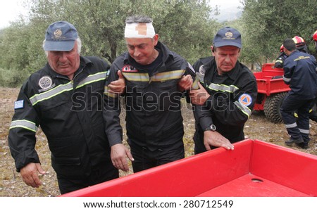 ILIA,GREECE,MAY 21,2015:Pan-European exercise of the Fire Brigade with evacuation and village houses complex, stalking and arson suspects arrested them, rescuing injured firefighters and citizen