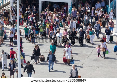 PAROS, GREECE, MAY 17, 2015: Passengers board the ship at the port of Paros in Greece.The Paros is an island in Cyclades that accepts too many tourists every year