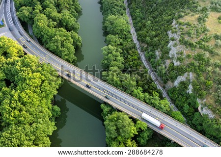 Aerial view of the bridge and the road over the river Pinios in the green valley of Tempe in Greece