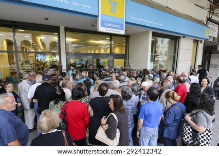 THESSALONIKI, GREECE, JULY, 1 2015: Pensioners queue outside a National Bank branch as banks only opened for the retired to allow them to cash up to 120 euros in Athens