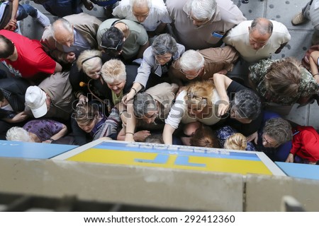 THESSALONIKI, GREECE, JULY, 1 2015: Pensioners queue outside a National Bank branch as banks only opened for the retired to allow them to cash up to 120 euros in Athens