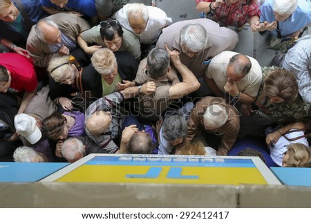 THESSALONIKI, GREECE, JULY, 1 2015: Pensioners queue outside a National Bank branch as banks only opened for the retired to allow them to cash up to 120 euros in Athens