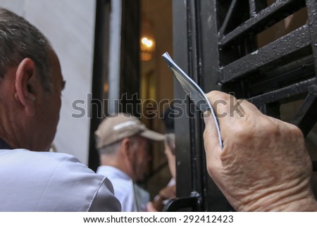 THESSALONIKI, GREECE, JULY, 1 2015: Pensioners queue outside a National Bank branch as banks only opened for the retired to allow them to cash up to 120 euros in Athens