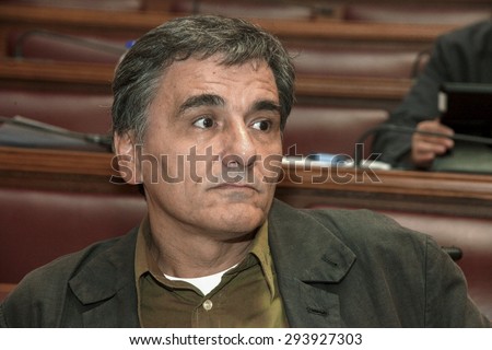 ATHENS, GREECE - OCT 14, 2014: The Greek government has announced that the new finance minister, Euclid Tsakalotos. Portraits