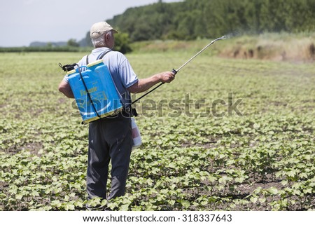 Thessaloniki, Greece - June 21, 2015: Farmer spraying cotton field in Greece.