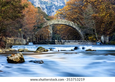 Old stone bridge in Klidonia Zagoria, Epirus, Western Greece. This arch bridge with elongated arch built in 1853. Long exposure using ND filter
