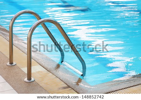 railing stairs down to the pool with fresh water