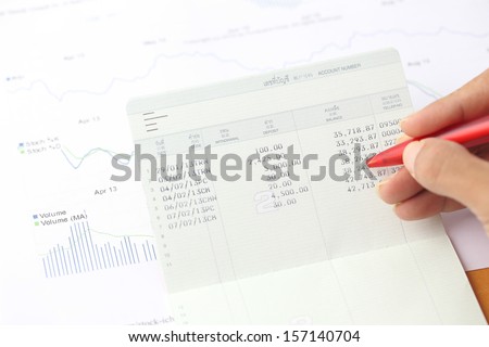 Account book report with hand of someone