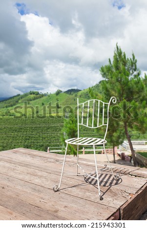 Chairs sitting by  mountain