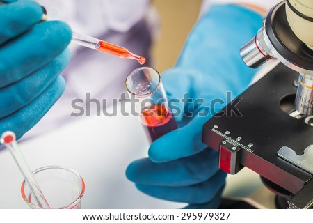 Hands of clinician holding tools during scientific experiment in laboratory,MERS