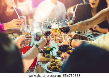 Group of partying girls clinking flutes with sparkling wine,Friend