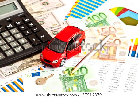 Toy car, money and other business staff