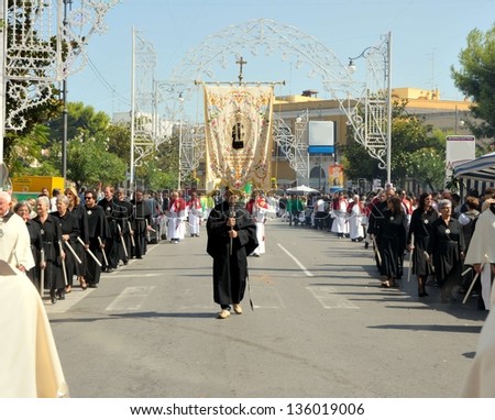 MODUGNO (BARI), ITALY-SEPT. 23: Faithful members of the brotherhoods of the country always accompany the procession of the patron saint.  23 September 2012 main streets in Modugno (Bari) ITALY
