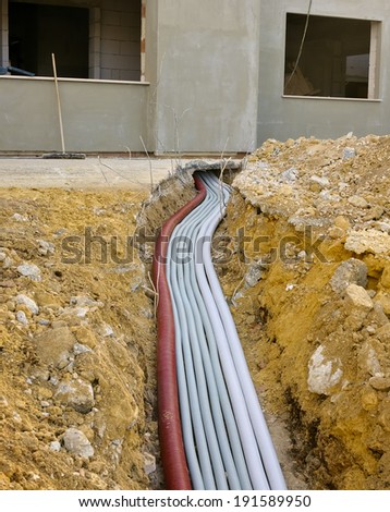 Power supply of general electric panel with a beam of corrugated pipes underground