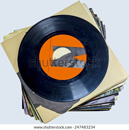 A pile of 45 RPM vinyl records used and dirty even if in good condition