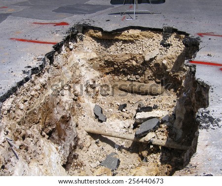 Cut away cross section of a road where maintenance work is being carried out