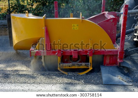 Milling of asphalt for road reconstruction accessory for skid steer