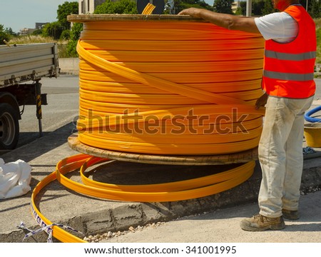 Industrial cable drums of fiber optic cables from underground in a micro trench