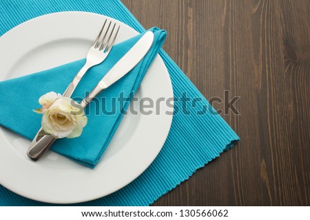 Dinner with Rose on Wooden Background