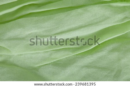 creased fabric background in green color