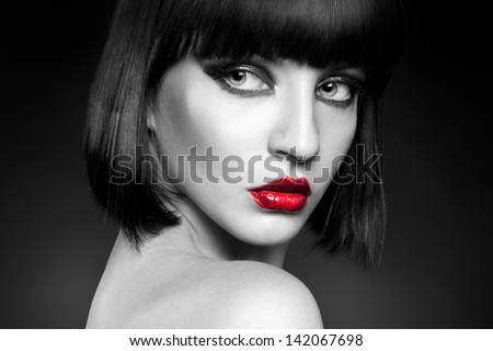 black and white portrait of pretty young brunette in studio