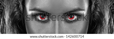 black and white photo of girl with red eyes in studio