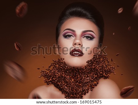 Creative photo manipulation with coffee beans and beauty woman in studio