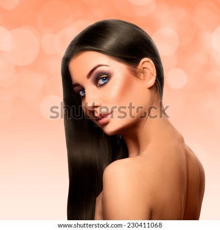 Sensual adult caucasian brunette with perfect streight black hair and nice make up on face in studio on abstract background