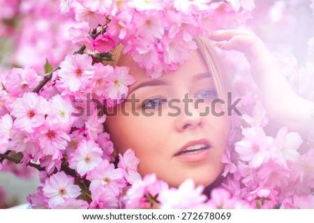 spring outdoor portrait of a charming girl in flowers bloom. High society
