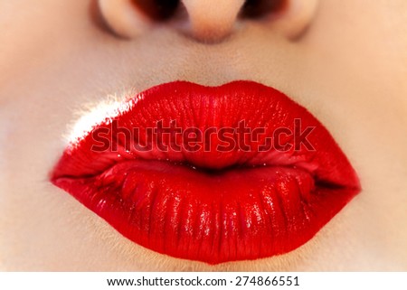 Macro photo of woman lips. Kissing with red lipstick on lips. Air kiss