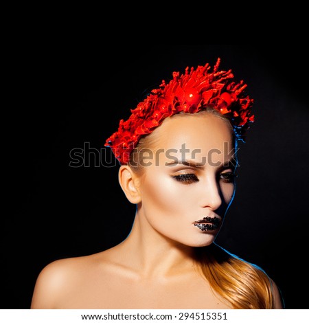 Square picture of beautiful woman with makeup and wreath on black background in studio