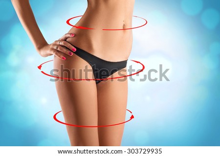 Sexy slim waist with drawing red arrows around. studio shot. horizontal.