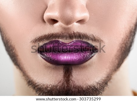Macro photo of bearded male lips with makeup. horizontal. closeup.