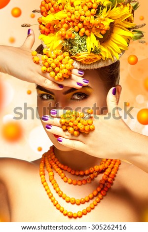 Glamour adult girl with beautiful makeup and rowan accessories hide face behind hands