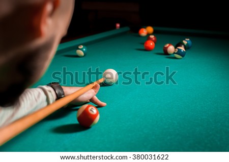 Fragment of the pool billiard game in process. American pool billiard. Pool billiard game. Billiard sport concept.
