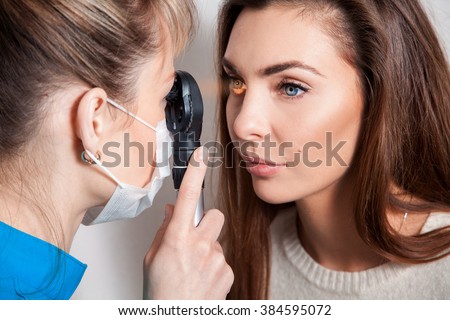 Ophthalmologist examines the eyes using a ophthalmic device. Ophthalmologist. medical, health, ophthalmology concept