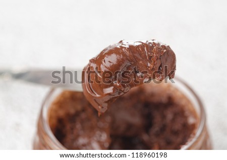 chocolate paste in a glass jar close up horizontal